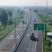 Cao tốc Bến Lức - Long Thành với cảnh đường giao thông hiện đại và thiên nhiên xung quanh.